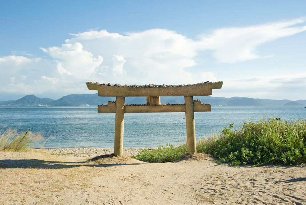Ebisu shrine's torii gate at Gotanji beach in Naoshima Japan